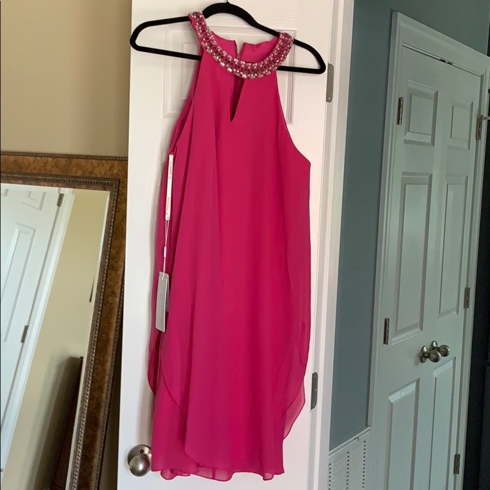 Fushia colored swing style cocktail dress.